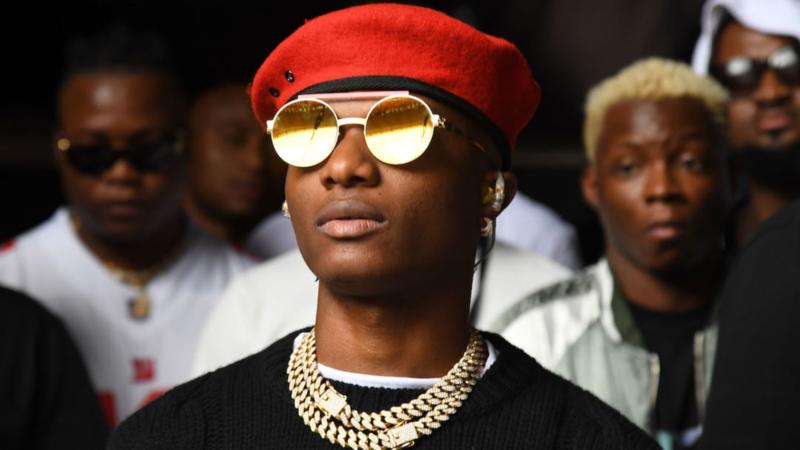 Ayodeji Balogun, better known by his stage name Wizkid, is a musician from Nigeria. When he was young, he created a band with several buddies from church called the Glorious Five and recorded an album.1